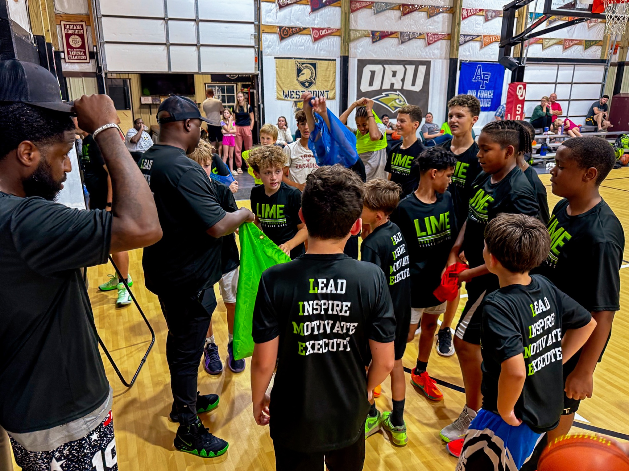 LIME coaches and young basketball players gathering with colorful practice jerseys